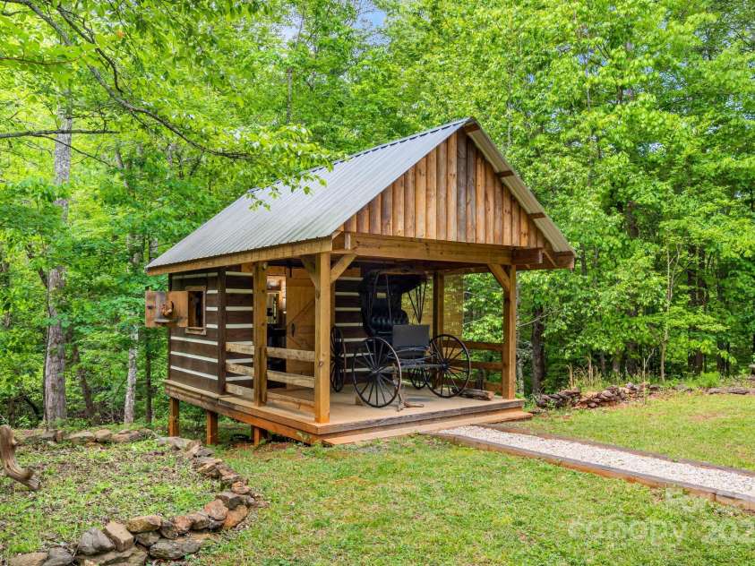 482 Pheasant Street, Lake Lure, NC 28746.  MLS# CAR4253575, YatesRealty ID 18417. Pole Barn with 1909 Dr.'s Buggy