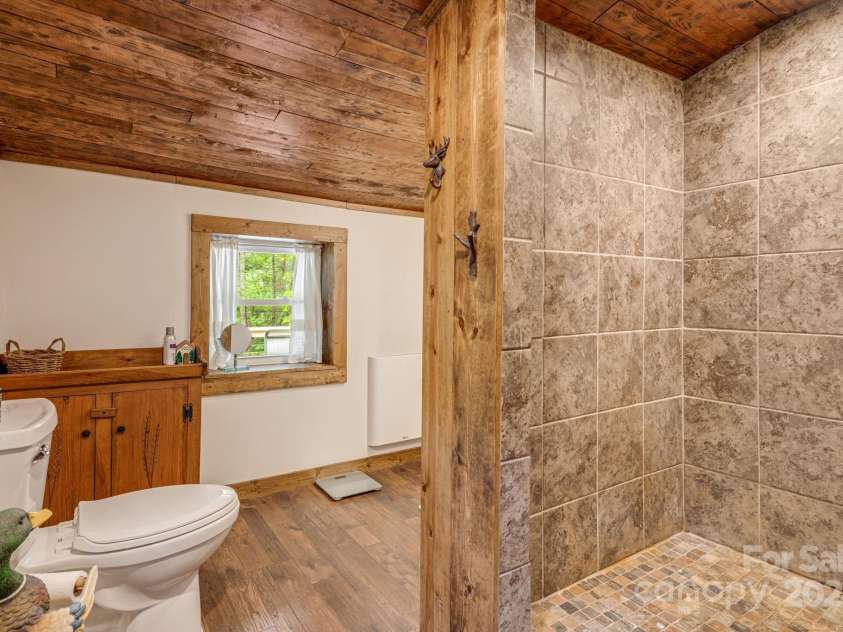 482 Pheasant Street, Lake Lure, NC 28746.  MLS# CAR4253575, YatesRealty ID 18417. Shower and Bathroom
