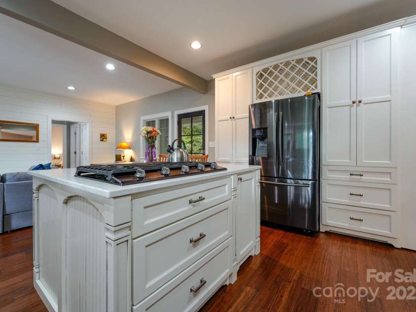 1360 Glen Cannon Drive, Pisgah Forest, NC 28768.  MLS# CAR4252378, YatesRealty ID 18419. Kitchen looking back to living room