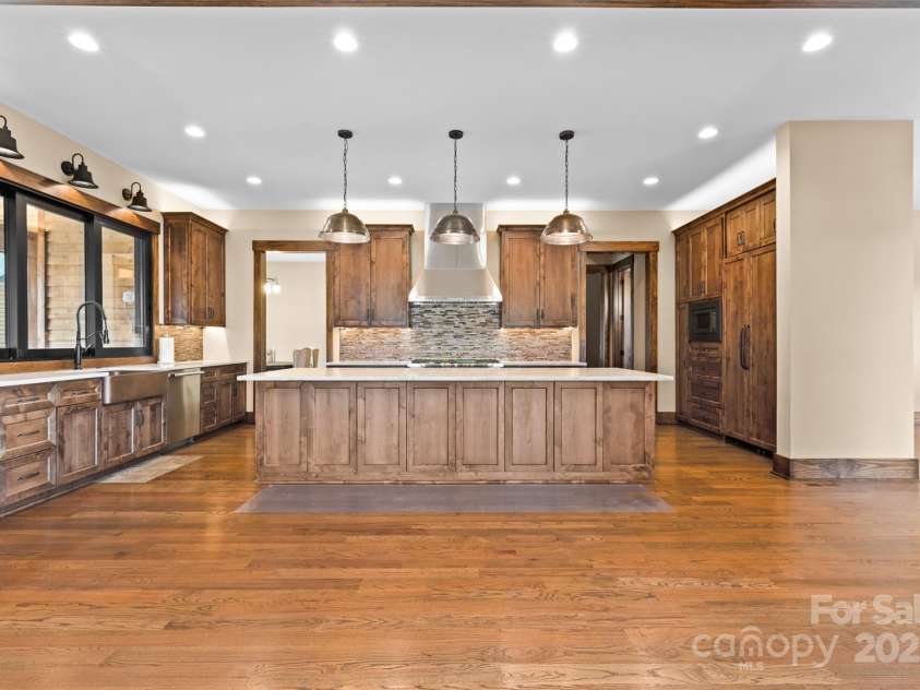 1822 Irby Road, Monroe, NC 28112.  MLS# CAR4259856, YatesRealty ID 1843. Large Kitchen Open to the Great Room with Fireplace 