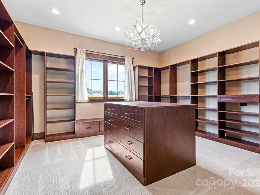 1822 Irby Road, Monroe, NC 28112.  MLS# CAR4259856, YatesRealty ID 1843. Massive Custom Owner's Suite Closet 