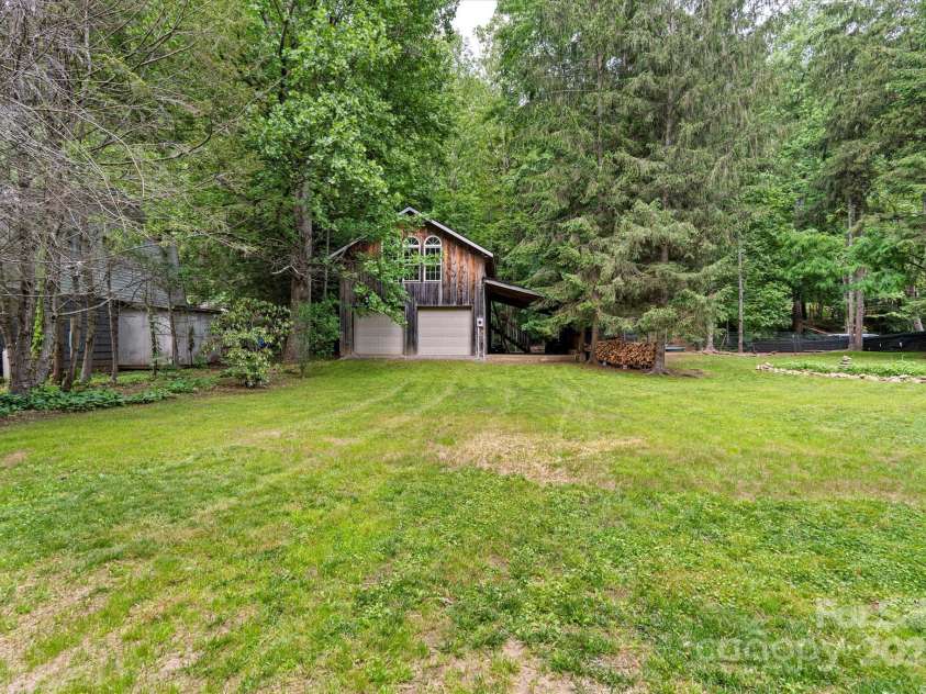 23 Mountain Meadow Lane, Canton, NC 28716.  MLS# CAR4269164, YatesRealty ID 18435. Expansive, level backyard