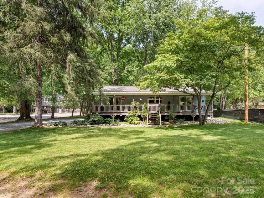 23 Mountain Meadow Lane, Canton, NC 28716.  MLS# CAR4269164, YatesRealty ID 18435. Level front yard faces East Fork Pigeon River