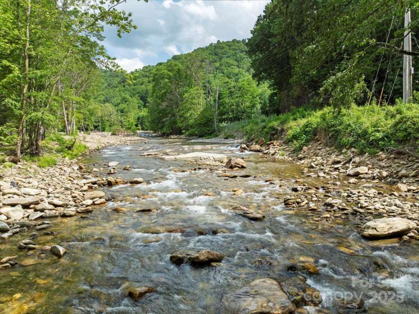 23 Mountain Meadow Lane, Canton, NC 28716.  MLS# CAR4269164, YatesRealty ID 18435. Looking upstream