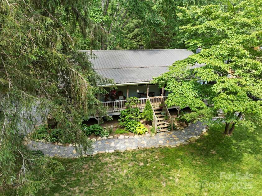 23 Mountain Meadow Lane, Canton, NC 28716.  MLS# CAR4269164, YatesRealty ID 18435. The lush, wooded lot adds to privacy and cools the house during the warm summer months.