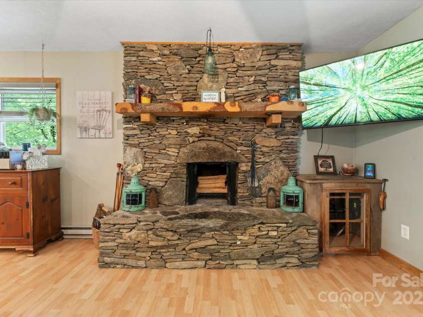 23 Mountain Meadow Lane, Canton, NC 28716.  MLS# CAR4269164, YatesRealty ID 18435. Wood burning fireplace
