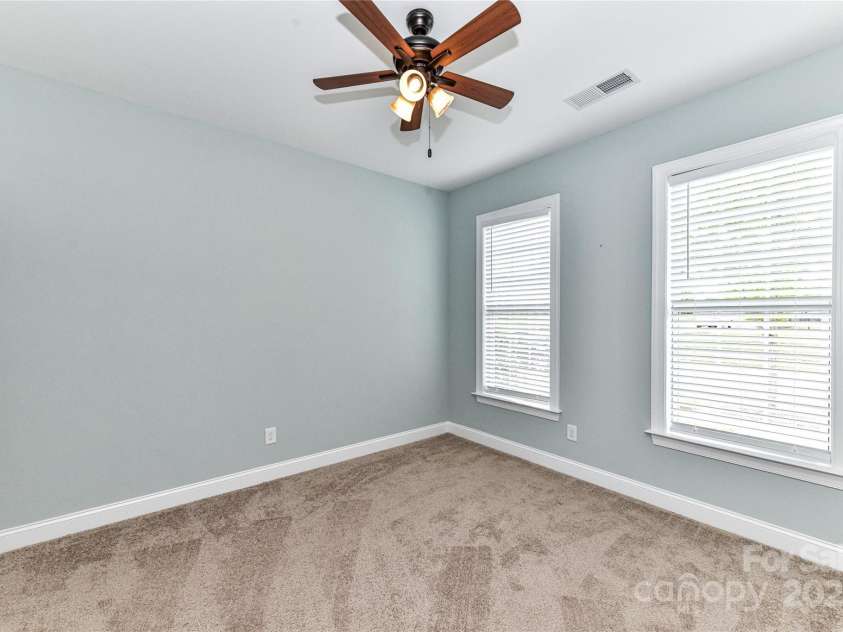 11123 Bailey Park Nature Drive, Cornelius, NC 28031.  MLS# CAR4247952, YatesRealty ID 18437. Bedroom 2 with ceiling fan/light!