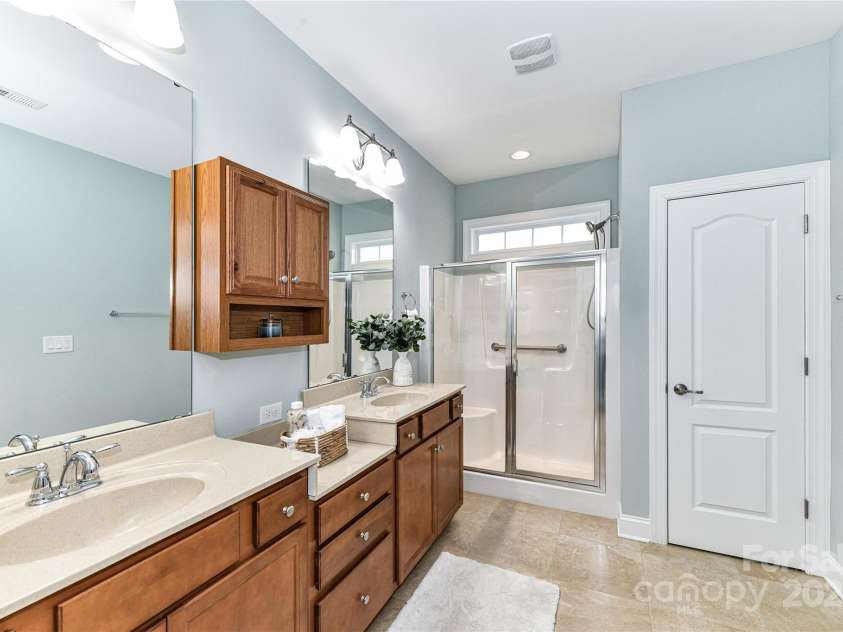 11123 Bailey Park Nature Drive, Cornelius, NC 28031.  MLS# CAR4247952, YatesRealty ID 18437. Primary Bath with dual vanity, shower, water closet & tile floors!