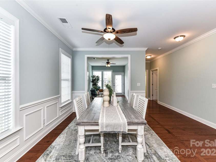 11123 Bailey Park Nature Drive, Cornelius, NC 28031.  MLS# CAR4247952, YatesRealty ID 18437. Spacious Dining Area with ceiling fan/light, crown molding, wainscoting & nice natural light!