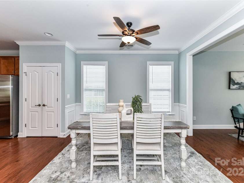 11123 Bailey Park Nature Drive, Cornelius, NC 28031.  MLS# CAR4247952, YatesRealty ID 18437. Spacious Dining Area with ceiling fan/light, crown molding, wainscoting & nice natural light!