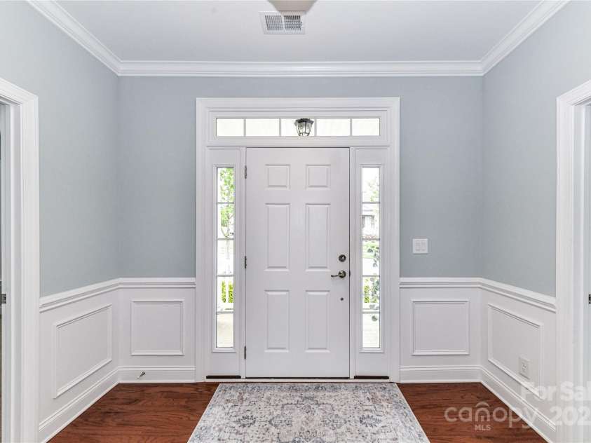 11123 Bailey Park Nature Drive, Cornelius, NC 28031.  MLS# CAR4247952, YatesRealty ID 18437. Welcoming Foyer with crown molding & picture frame wainscoting!