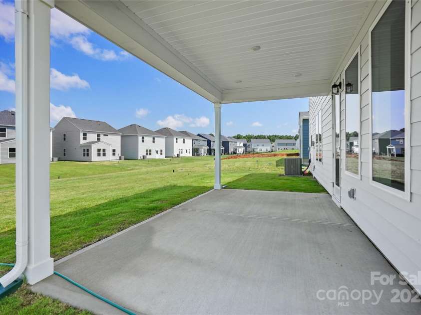 12009 Grinstead Lane, Charlotte, NC 28278.  MLS# CAR4268807, YatesRealty ID 18438. Rear covered patio