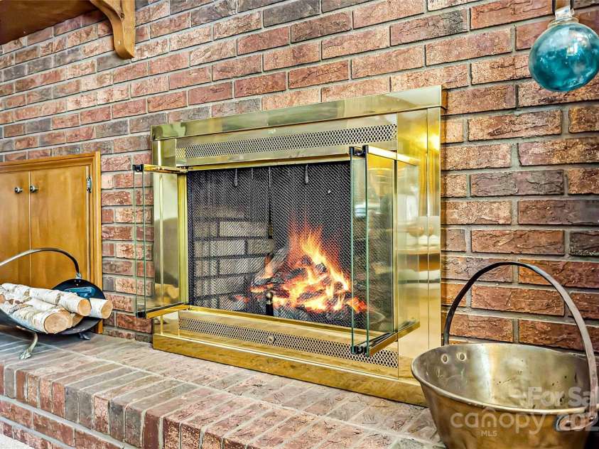 7050 US 70 Highway, Old Fort, NC 28762.  MLS# CAR4265680, YatesRealty ID 18445. Livingroom fireplace