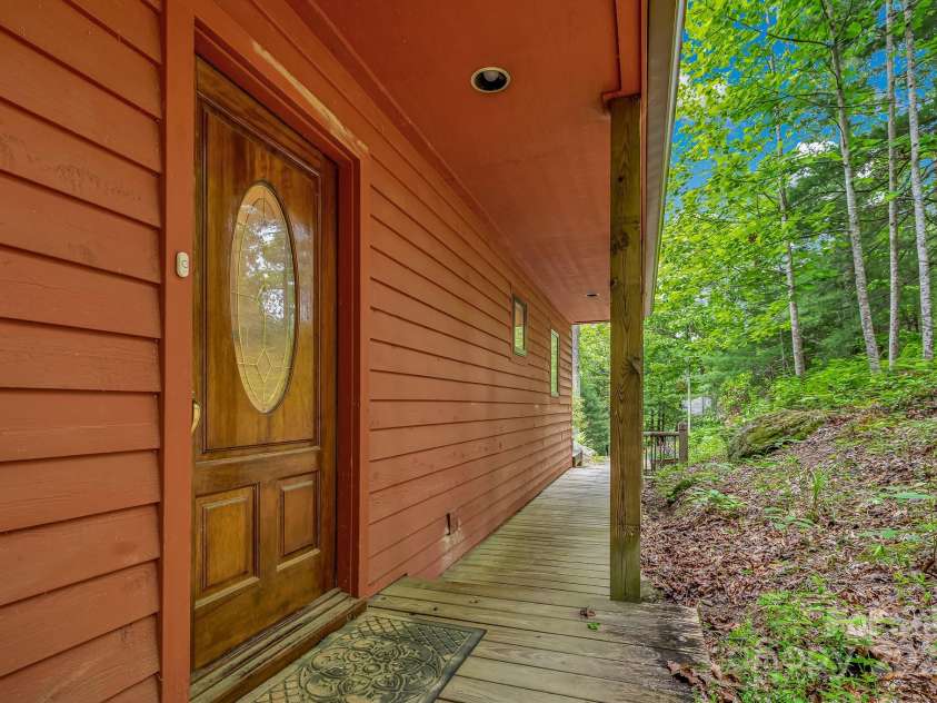 214 Laurel Mountain Trail, Saluda, NC 28773.  MLS# CAR4259688, YatesRealty ID 18449. Covered walkway to the house from the parking area.