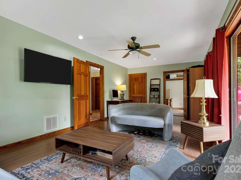 214 Laurel Mountain Trail, Saluda, NC 28773.  MLS# CAR4259688, YatesRealty ID 18449. Family room or secondary bedroom on the first floor has two closets, one large enough to be an office.