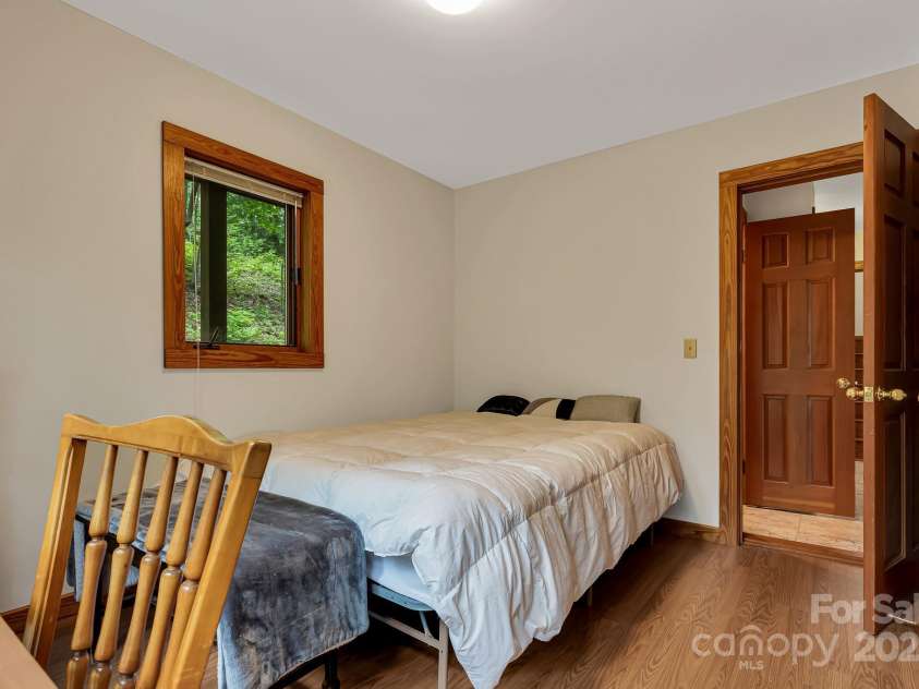 214 Laurel Mountain Trail, Saluda, NC 28773.  MLS# CAR4259688, YatesRealty ID 18449. First floor bedroom.