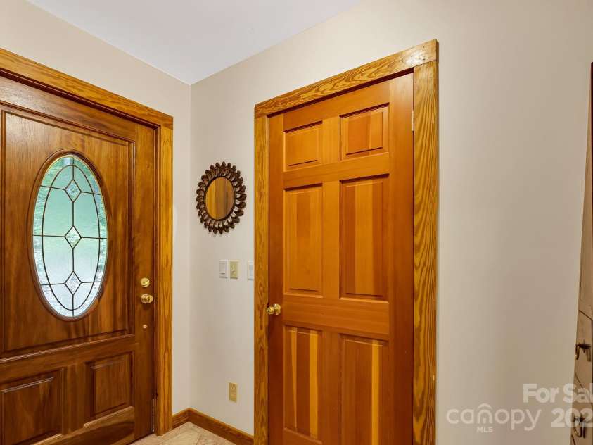 214 Laurel Mountain Trail, Saluda, NC 28773.  MLS# CAR4259688, YatesRealty ID 18449. Foyer with large walk-in closet.