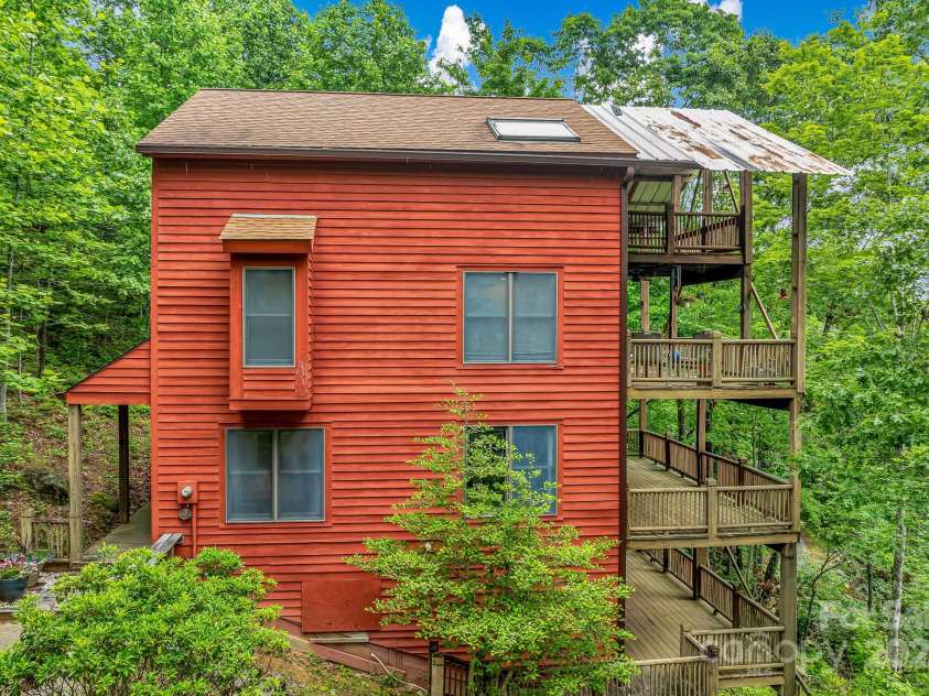 214 Laurel Mountain Trail, Saluda, NC 28773.  MLS# CAR4259688, YatesRealty ID 18449. From the outside you can walk down to the lowest deck which is on the crawlspace level.