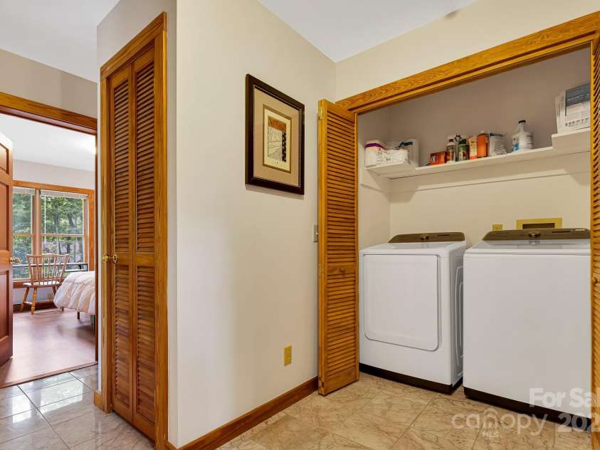 214 Laurel Mountain Trail, Saluda, NC 28773.  MLS# CAR4259688, YatesRealty ID 18449. Full bathroom and bedroom on this level.