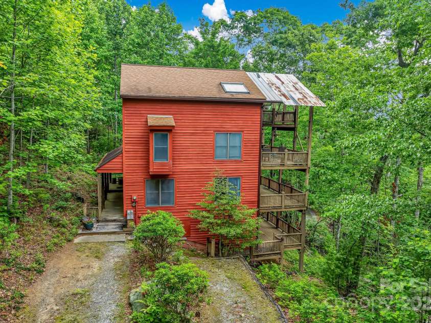 214 Laurel Mountain Trail, Saluda, NC 28773.  MLS# CAR4259688, YatesRealty ID 18449. The bottom deck gives you access to over 400 square feet of usable crawlspace storage with a high ceiling.