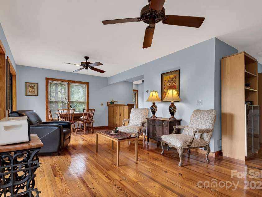 214 Laurel Mountain Trail, Saluda, NC 28773.  MLS# CAR4259688, YatesRealty ID 18449. The middle level is the heart of the home boasting hardwood floors and tons of light.
