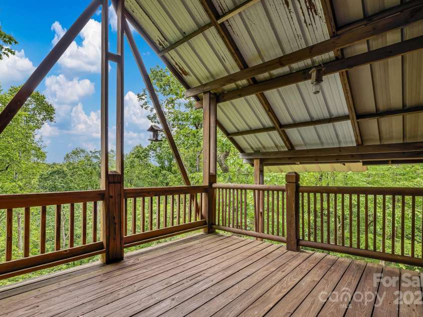 214 Laurel Mountain Trail, Saluda, NC 28773.  MLS# CAR4259688, YatesRealty ID 18449. This private top floor deck has the best views.  Long range views will open up in the winter.