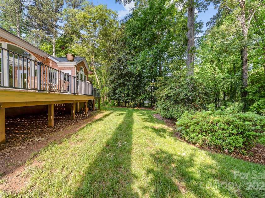 122 Waterford Drive, Mooresville, NC 28117.  MLS# CAR4260054, YatesRealty ID 18454. Expansive New Deck overlooks the backyard