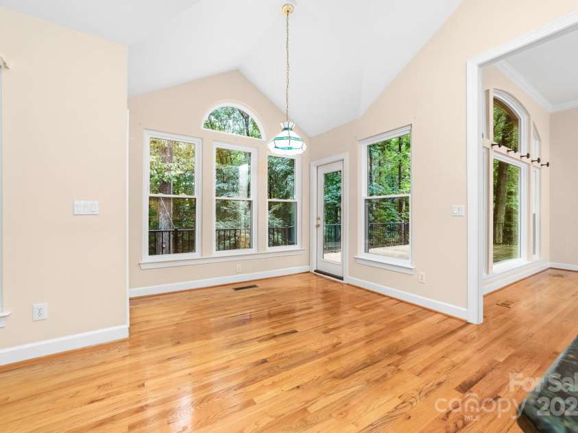 122 Waterford Drive, Mooresville, NC 28117.  MLS# CAR4260054, YatesRealty ID 18454. Kichen open to dining nook with deck access
