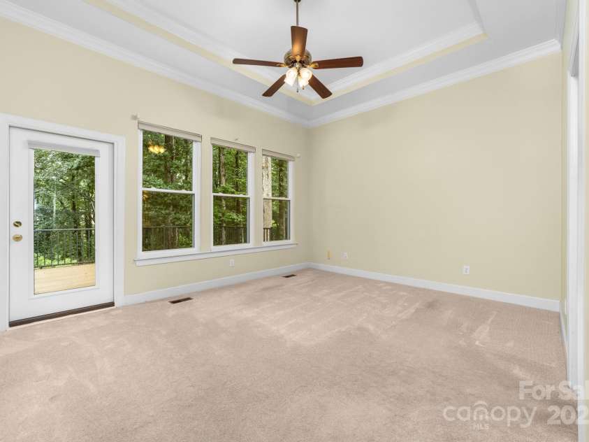 122 Waterford Drive, Mooresville, NC 28117.  MLS# CAR4260054, YatesRealty ID 18454. Primary Bedroom with door to the deck