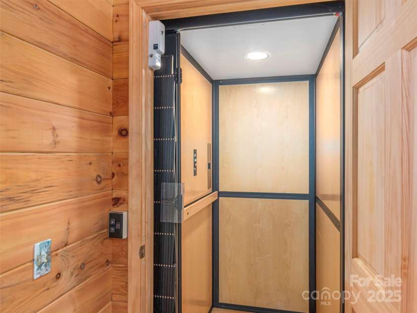 47 Tammy Drive, Maggie Valley, NC 28751.  MLS# CAR4267219, YatesRealty ID 18458. Elevator