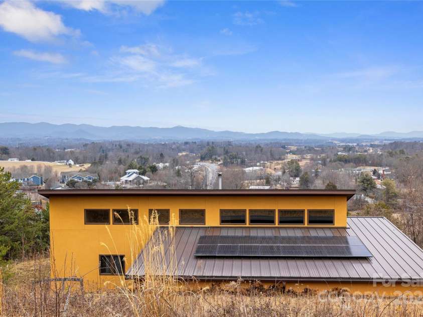 51 Climbing Aster Way, Asheville, NC 28806.  MLS# CAR4218419, YatesRealty ID 18459. Modern Mountain Masterpeice!