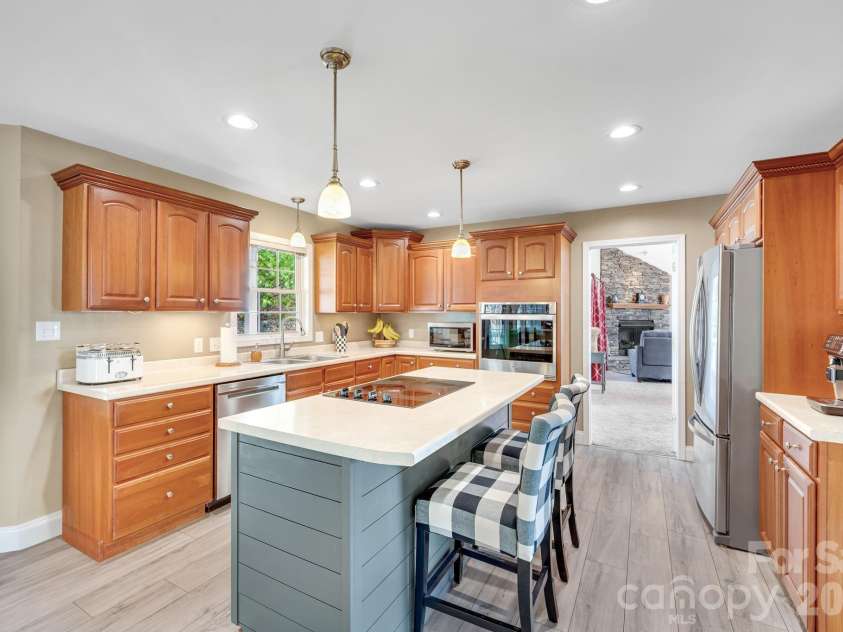 65 Lawson Ridge Road, Leicester, NC 28748.  MLS# CAR4352526, YatesRealty ID 18460. Kitchen island seating area