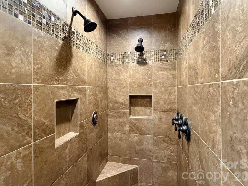 65 Lawson Ridge Road, Leicester, NC 28748.  MLS# CAR4352526, YatesRealty ID 18460. Primary Bathroom Dual Shower