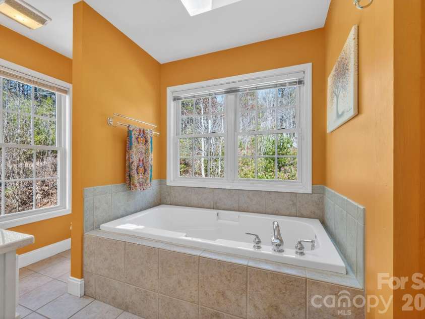 65 Lawson Ridge Road, Leicester, NC 28748.  MLS# CAR4352526, YatesRealty ID 18460. Primary bathroom soaking tub