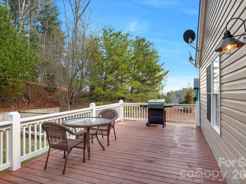 65 Lawson Ridge Road, Leicester, NC 28748.  MLS# CAR4352526, YatesRealty ID 18460. Rear deck outdoor dining