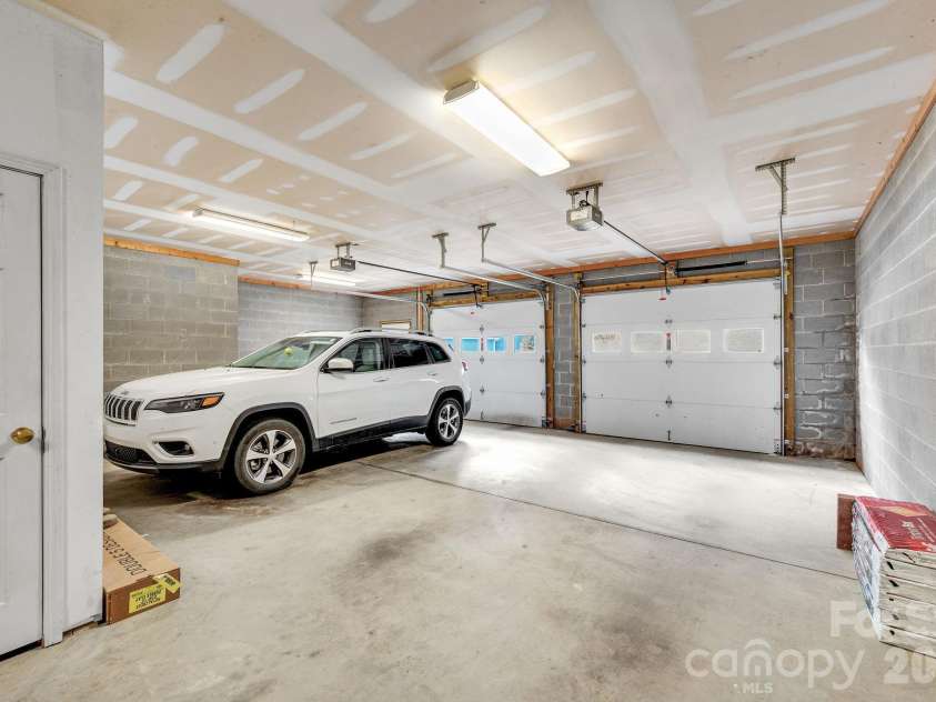 65 Lawson Ridge Road, Leicester, NC 28748.  MLS# CAR4352526, YatesRealty ID 18460. Two car garage interior