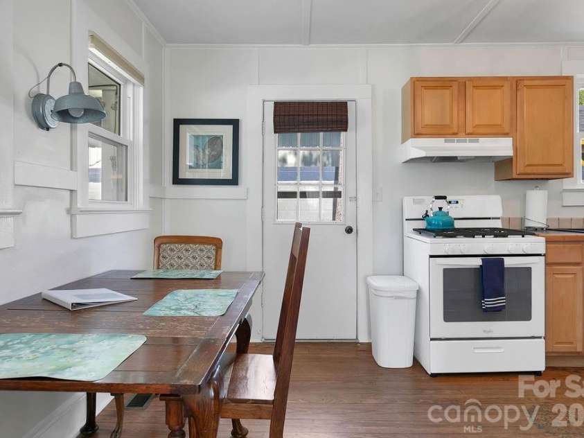 46 Oaklawn Avenue, Brevard, NC 28712.  MLS# CAR4367807, YatesRealty ID 18464. Dining to Kitchen