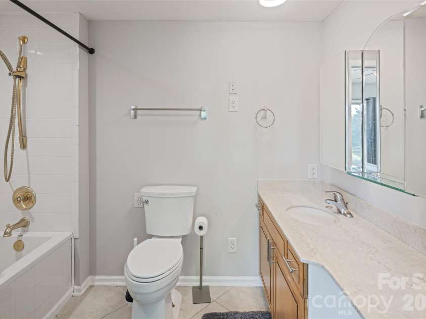 146 Cherokee Lane, Purlear, NC 28665.  MLS# CAR4374878, YatesRealty ID 18468. Main Level Ensuite Bathroom