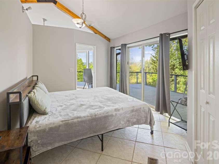 146 Cherokee Lane, Purlear, NC 28665.  MLS# CAR4374878, YatesRealty ID 18468. Main Level Guest Bedroom
