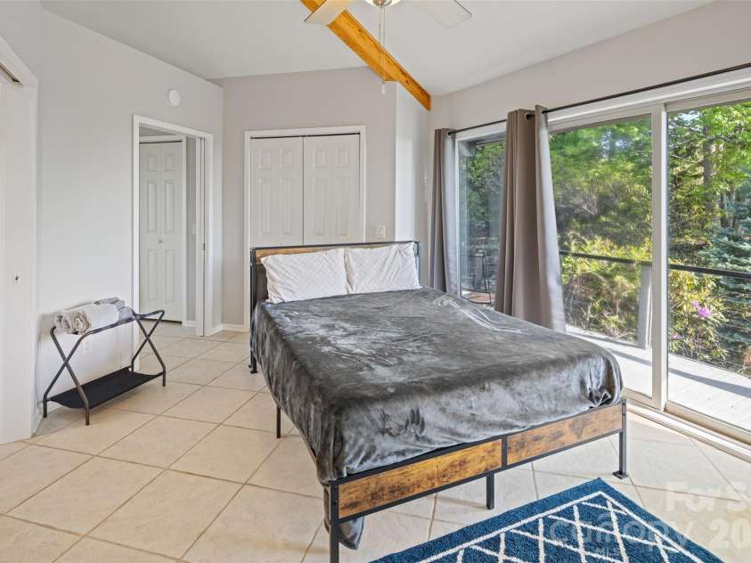 146 Cherokee Lane, Purlear, NC 28665.  MLS# CAR4374878, YatesRealty ID 18468. Main Level Primary Bedroom with Ensuite Bathroom