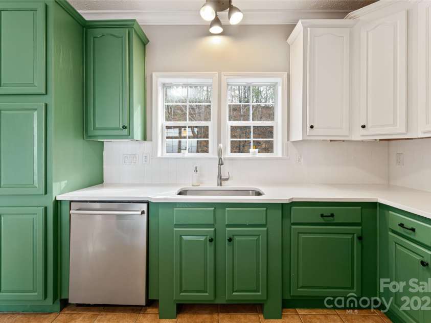 837 California Avenue, Marion, NC 28752.  MLS# CAR4260788, YatesRealty ID 1847. Kitchen with great storage and new farm sink.