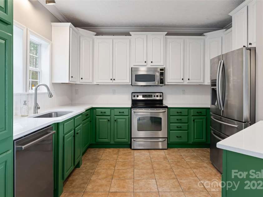 837 California Avenue, Marion, NC 28752.  MLS# CAR4260788, YatesRealty ID 1847. Stainless steep appliances and freshly painted cabinets.