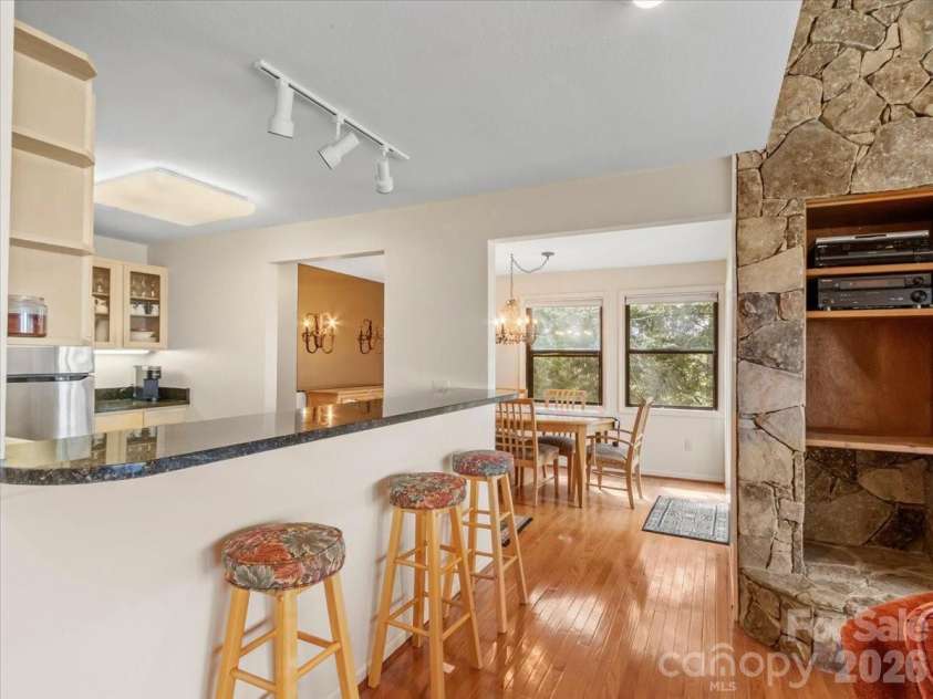 19 Lookout Loop, Burnsville, NC 28714.  MLS# CAR4361238, YatesRealty ID 18471. FLOOR TO CEILING STONE FIREPLACE