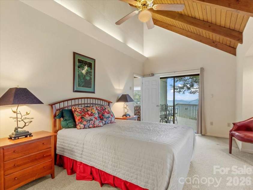 19 Lookout Loop, Burnsville, NC 28714.  MLS# CAR4361238, YatesRealty ID 18471. PRIMARY BDRM - GLASS SLIDERS TO OPEN DECK
