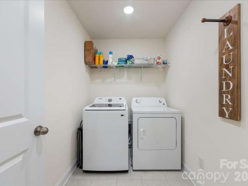 5923 Hampstead Pond Lane, Matthews, NC 28105.  MLS# CAR4340634, YatesRealty ID 18474. Large laundry room.