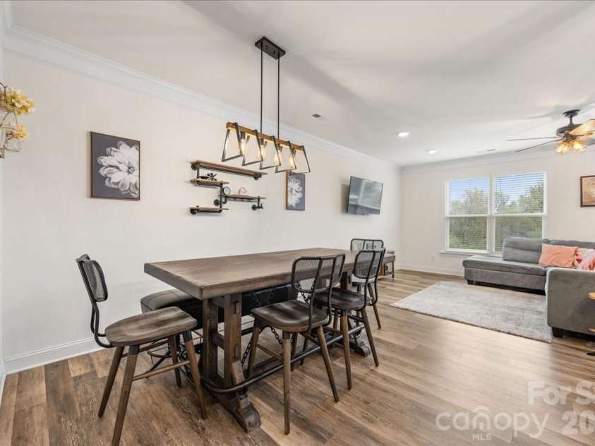 5923 Hampstead Pond Lane, Matthews, NC 28105.  MLS# CAR4340634, YatesRealty ID 18474. Spacious dining area overlooking great room.