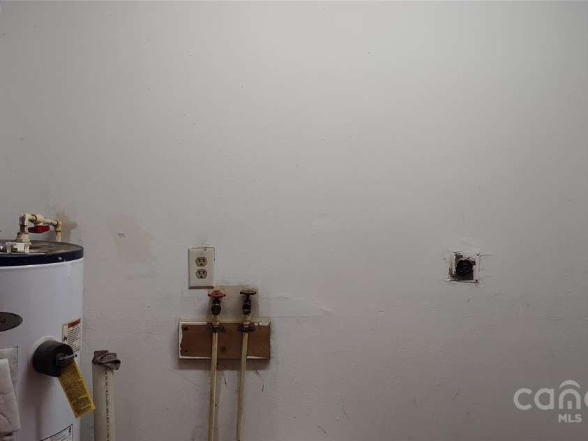 7881 US 25/70 Highway, Marshall, NC 28753.  MLS# CAR4257873, YatesRealty ID 18474. Laundry space and water heater