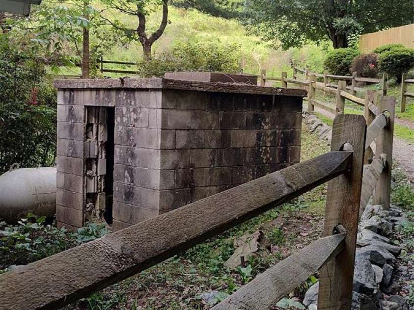 7881 US 25/70 Highway, Marshall, NC 28753.  MLS# CAR4257873, YatesRealty ID 18474. Old spring house