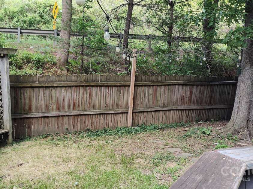 7881 US 25/70 Highway, Marshall, NC 28753.  MLS# CAR4257873, YatesRealty ID 18474. Private yard inside the fence
