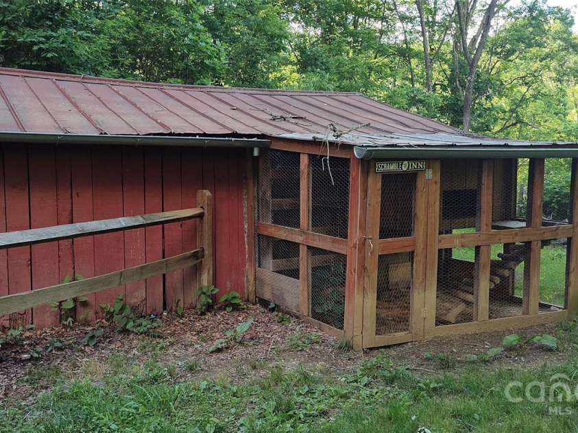 7881 US 25/70 Highway, Marshall, NC 28753.  MLS# CAR4257873, YatesRealty ID 18474. Shed with chicken coop